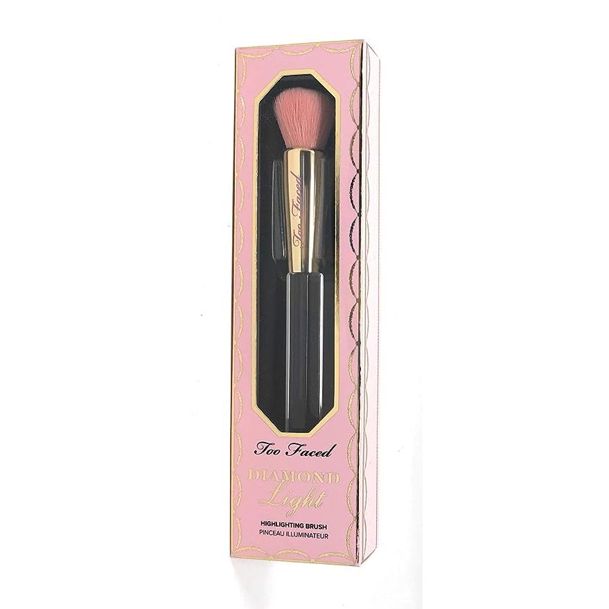 Elevate your makeup game with the Too Faced Diamond Light Highlighting Brush, the ultimate tool for a bespoke, luminous finish. Expertly engineered to illuminate your features, this premium brush is the secret to a seamless highlighter application that will leave you glowing. Its specialized construction and avant-garde design ensure your complexion looks nothing short of flawless and resplendent.

The brush boasts luxe, ultra-plush synthetic bristles that glide effortlessly over the skin, ensuring an immaculate blend without any harsh lines. The dense yet supple fibers pamper your skin, allowing for a sublime, strobe-effect that feels as gentle as it looks striking. Embrace the indulgence of a professional cosmetic experience right at your fingertips.

At the forefront of makeup innovation, the Too Faced Diamond Light Highlighting Brush's distinctive diamond-shaped head is precision-engineered for targeted application. Effortlessly accentuate your cheekbones, brow bones, and cupid's bow with the tapered tip that sculpts and defines with enviable accuracy. Paired with an ergonomic lightweight handle that offers optimal control, this brush isn't just a tool—it's your passport to a radiant and exquisitely sculpted visage.

This opulent brush isn't merely functional – its design speaks volumes of its posh and chic allure. Adorned with a lustrous metallic hue, the handle is a statement of elegance, complemented by sophisticated diamond-inspired detailing and the signature Too Faced engraving. It's not just a brush; it's a centerpiece in your beauty repertoire that signifies luxury.

Indispensable for both beauty aficionados and seasoned pros, the Too Faced Diamond Light Highlighting Brush is the cornerstone for a captivating highlight that dazzles. Marrying exceptional craftsmanship with a sleek, thoughtful design, it's the critical addition your beauty arsenal craves for an endless, enchanting glow.