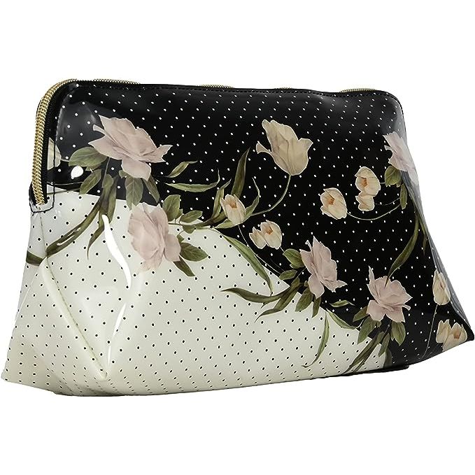 Immerse yourself in the allure of the elderflower – a symbol of the brand's flair for combining nature with high fashion. This Ted Baker washbag showcases a stunning elderflower print, playing homage to contemporary floral aesthetics while maintaining a timeless charm. The sleek execution of patterns against the washbag’s luxe fabric ensures it stands out, making it an indispensable accessory for anyone looking to infuse their daily beauty routine with a splash of glamour.