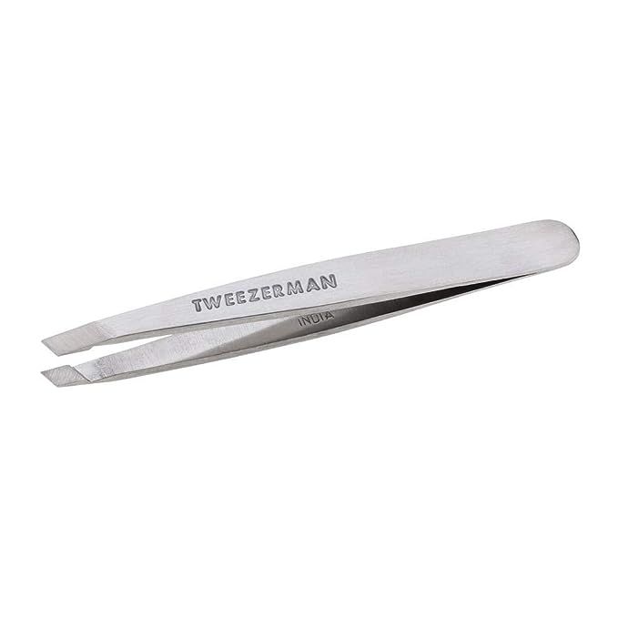 Elevate your grooming game with the Tweezerman Stainless Steel Mini Slant Tweezers – your essential tool for unparalleled precision in hair removal.