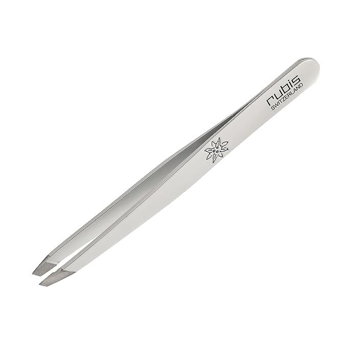 Achieve flawless arches with the Rubis Classic Slanted Tweezers, model 1K105—instantly recognizable by their sleek white finish and Swiss-made quality assurance.