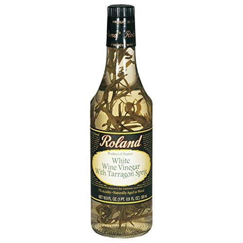 Experience the exquisite taste of Roland French White Wine Vinegar with Tarragon Sprig - 16.9 oz. This premium vinegar is a go-to ingredient in kitchens worldwide, known for its versatility and exceptional quality. Crafted using traditional French methods, this 16.9-ounce bottle contains a tangy and aromatic liquid that is sure to elevate your culi