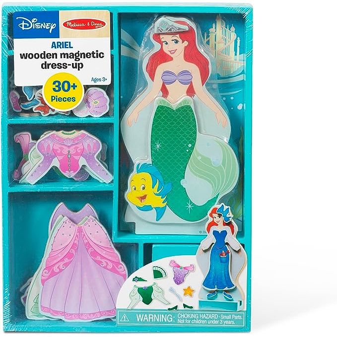Introduce your little one to a world of enchantment with the Ariel Dress-Up Set from Melissa & Doug. This captivating wooden doll pretend play set features Disney's Ariel and a collection of magnetic clothing pieces and accessories.