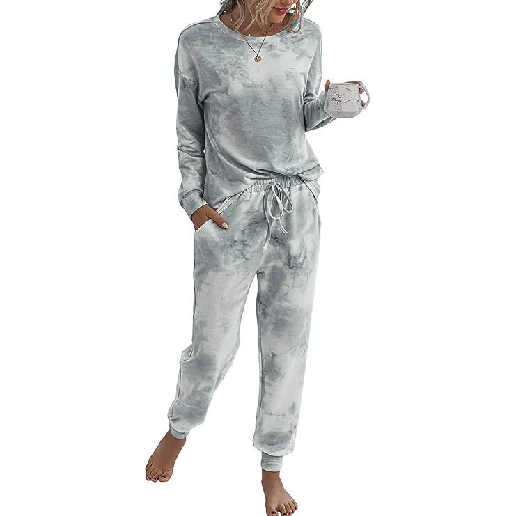 Introducing our exclusive Two Piece Pajamas Set, expertly designed to provide the utmost comfort and style. Crafted from a luxurious blend of 85% polyester and 15% spandex, this set offers a heavenly softness that will indulge your senses.