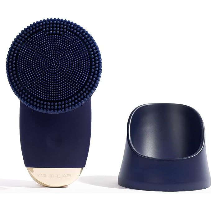 Introducing a revolutionary skincare tool designed for deep cleansing and rejuvenation - the YouthLab SoniGlow Navy Silicone Facial Skin Cleansing Brush. This electric and vibrating facial scrubber offers a range of benefits, including hygienic cleansing, exfoliation, massage, firming, toning, reducing blackheads and refining pores.