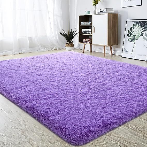 Super Soft Area Rug: Enhance the beauty of your home decor with our Super Soft Area Rug. This fluffy rug comes in a range of beautiful colors and has a luxurious soft touch that adds warmth and comfort to any room. Not only does it make your space seem vibrant and inviting, but it also acts as a decorative element in your home.