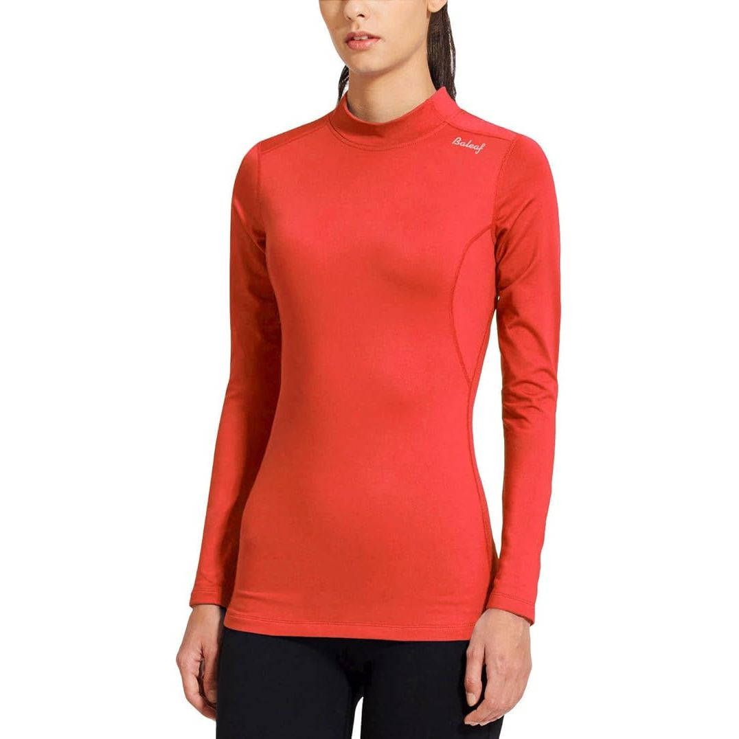 Stay warm and stylish during your cold weather workouts with the BALEAF Women's Fleece Thermal Mock Neck Long Sleeve Running Shirt. Crafted from high-quality materials, this top offers exceptional insulation and comfort for outdoor activities.