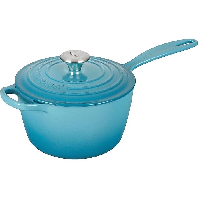 Le Creuset is a well-known brand in the world of cookware, and one of their standout products is the Le Creuset Enameled Cast Iron Signature Saucepan. This saucepan, with a 2.25-quart capacity and a beautiful Caribbean color, is crafted from enameled cast iron renowned for its durability and heat retention capabilities.