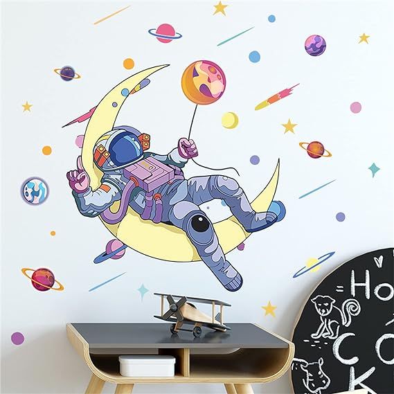 Introducing our premium quality removable astronaut wall sticker! Made with excellent material, this wall decal is crafted from premium ECO-friendly waterproof PVC. Rest assured that it is non-toxic and safe for use in your home. With 2 sheets measuring 35.4'' x 11.8'', this pack offers great value.