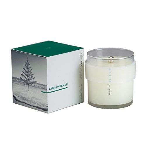 Introducing the .CHRISMUKKAH scented candle, a delightful blend of fresh green fir, clove, and ocean air. This fragrance has been voted Interior Fragrance of the Year, and it's not hard to see why. With its festive and inviting aroma, it's perfect for celebrating Christmas, Chanukkah, Kwanzaa, or just gathering with friends and family.