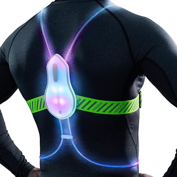 Introducing the Tracer2 Reflective Running Vest by Noxgear, the ultimate safety accessory for outdoor activities. This innovative vest offers all the colors in one with its ability to change between 8 super bright solid colors and 8 eye-catching multicolor flashing modes.