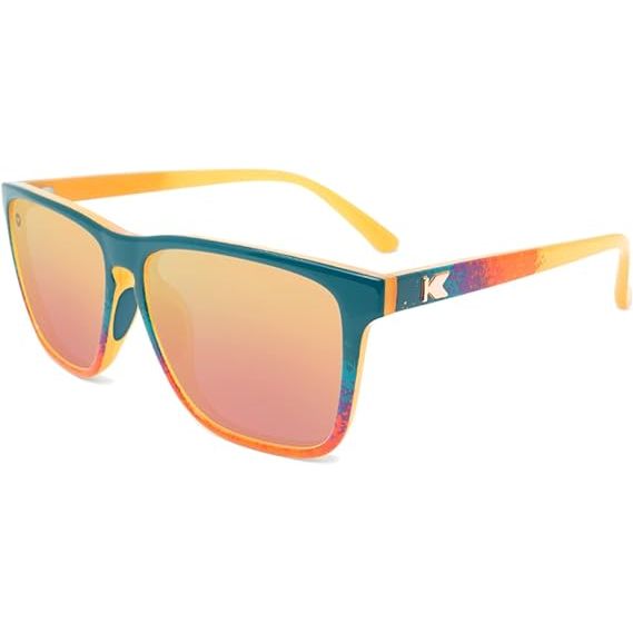 Introducing the Knockaround Fast Lanes, your new go-to sunglasses for all your outdoor adventures. These unisex sunglasses feature a speckled sunset fade plastic frame, giving them a unique and stylish look.