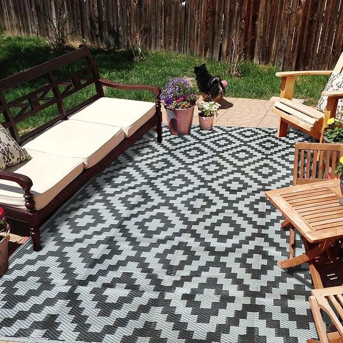 Introducing our Reversible Mats - an elegant and functional addition to your patio or outdoor space. With a timeless design, these plastic patio rugs are perfect for showcasing your personal style alongside your outdoor furniture and accessories. Made from 100% virgin polypropylene, these mats are not only soft and durable but also low-maintenance.