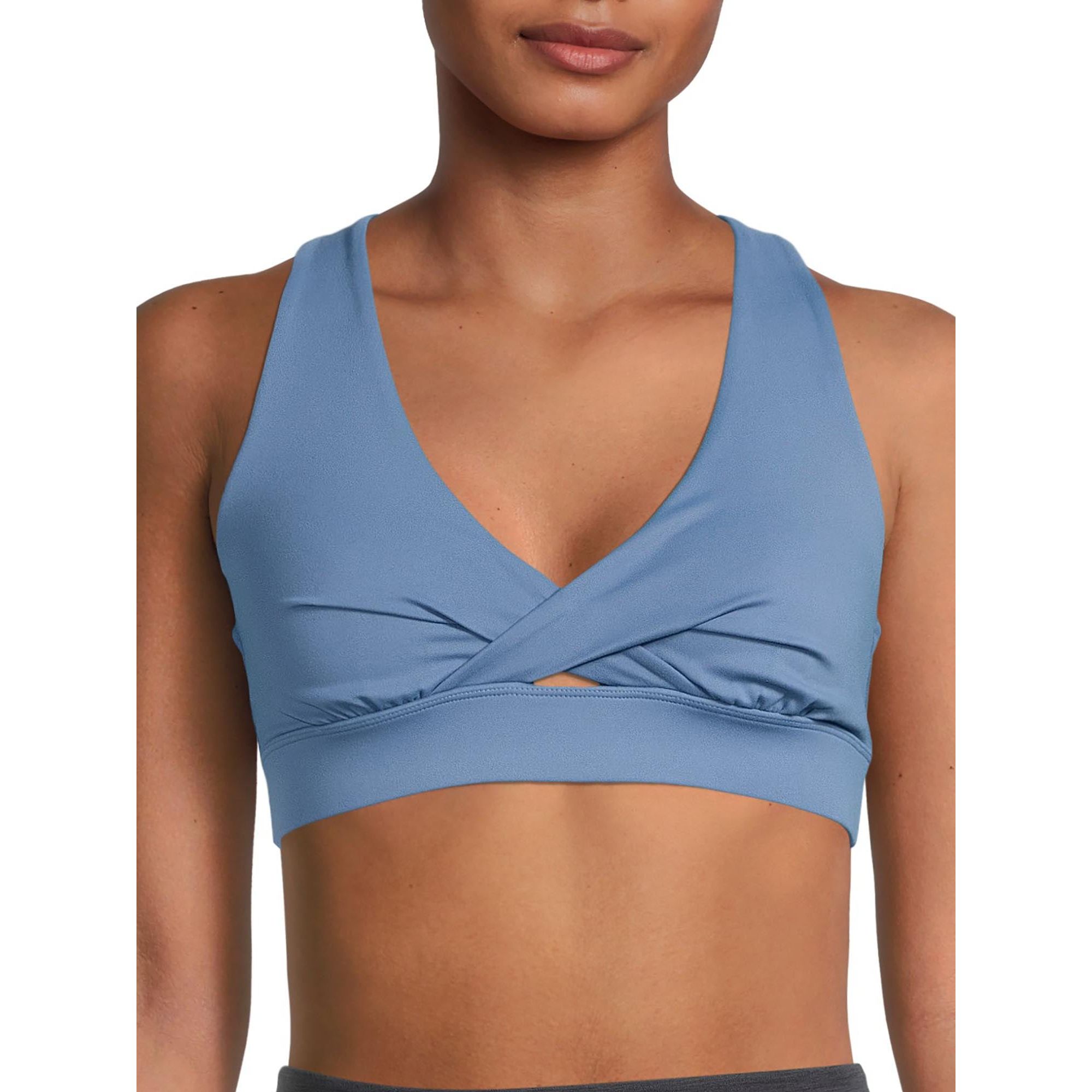 The Avia Women's Twist Front Sports Bra is a top pick for active women seeking a blend of comfort, support, and style during their workouts. Crafted from high-quality materials, this sports bra prioritizes comfort with a soft, moisture-wicking fabric that keeps the wearer dry and irritation-free during high-impact activities.