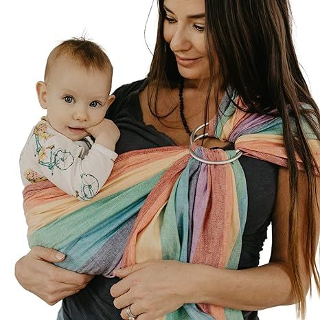 The Hip Baby Wrap is a highly breathable and lightweight baby carrier made from 100% cotton, ensuring your baby's comfort while being carried. This hand-loomed woven wrap features top-quality aluminum ring slings and is suitable for babies weighing 8-35 pounds.