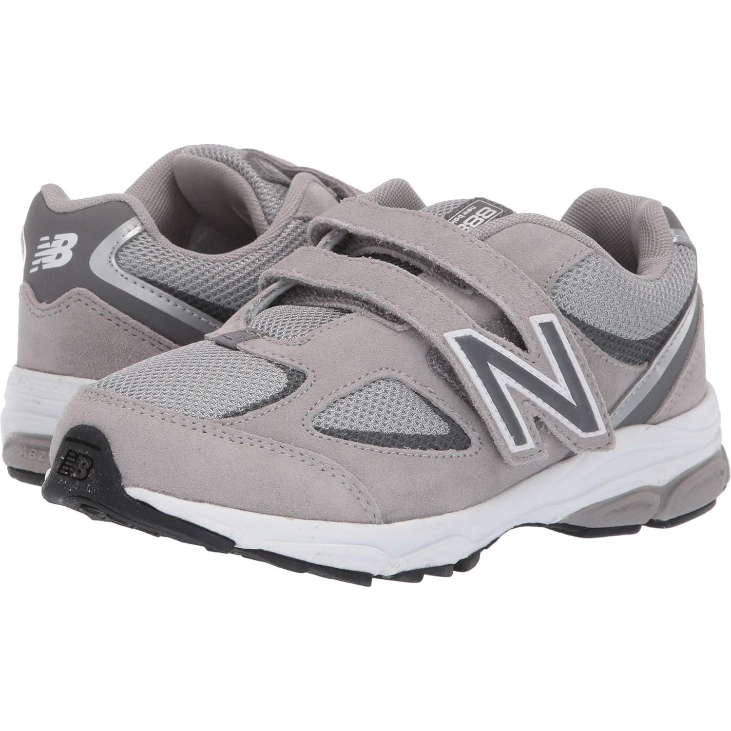 The New Balance Kid's 888 V2 Hook and Loop Running Shoe is designed for young athletes who enjoy running and staying active. This shoe features a lightweight and breathable mesh upper that provides ample ventilation and a comfortable fit.