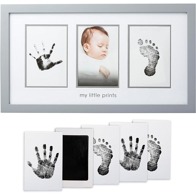 The Pearhead Newborn Babyprints Photo Frame is a gender-neutral keepsake kit designed for parents to cherish their baby's handprints and footprints. This kit includes a non-toxic ink pad and imprint cards to create lasting memories of your little one's tiny hands and feet. The gray frame measures 13.75" x 11.