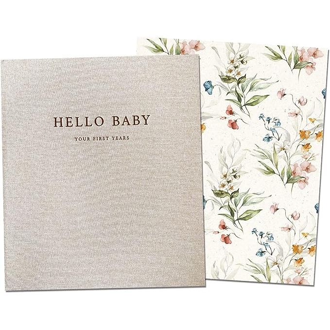 The Peachly Baby Memory Book is a beautiful and minimalist floral first-year keepsake designed to capture all of your baby's milestones and memories. It comes in a stylish beige linen cover with a delicate floral design, perfect for a baby girl.