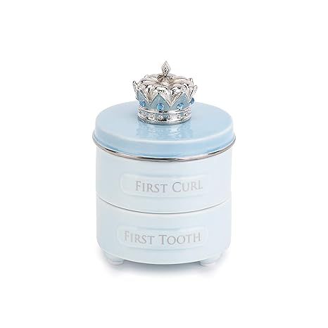 The First Tooth and Curl Soft Blue Ceramic and Pewter Baby Keepsake Box is a 4 x 3 inch box designed to hold a baby's first tooth and first curl. Made of ceramic and pewter, this keepsake box is both durable and stylish, with a soft blue finish that is ideal for both boys and girls.