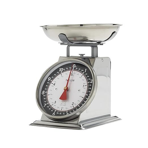 The Taylor Mechanical Kitchen Weighing Food Scale is a must-have tool for any home chef seeking precision and efficiency in the kitchen. With a generous weight capacity of 11lbs, this scale can handle a wide range of ingredients, ensuring accurate measurements in both grams and ounces for precise cooking and baking.