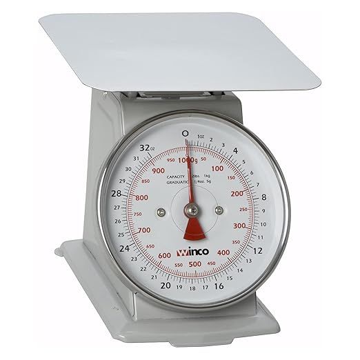 The Winco SCAL-62 is a professional-grade 2-pound/1kg scale featuring a large 6.5-inch dial, specifically designed for precise measurements in commercial kitchens and food service establishments. This scale is essential for maintaining consistency in recipes and portion sizes, ensuring high-quality food preparation every time.