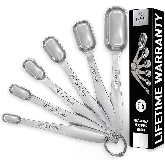 Crafted from premium stainless steel, the Zulay Heavy Duty Measuring Spoons offer durability and precision for all your culinary needs. The slim design of these spoons allows for easy access to narrow spice jars, making them a versatile must-have in any kitchen.