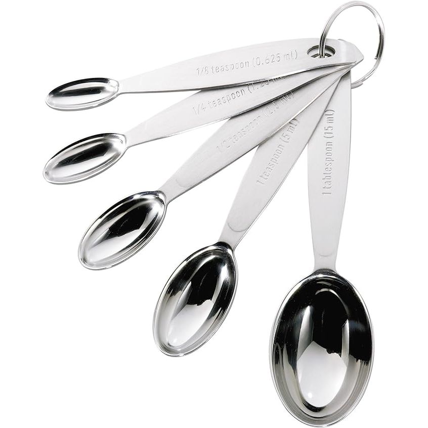 Upgrade your kitchen arsenal with the Cuisipro Silver Measuring Spoon Set, a must-have for any culinary enthusiast. This set contains four essential measuring spoons, including 1/4 teaspoon, 1/2 teaspoon, 1 teaspoon, and 1 tablespoon, all made of sturdy stainless steel with a chic silver finish.