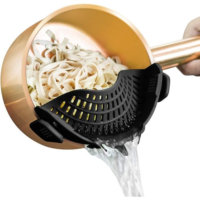 The AUOON Clip On Strainer Silicone is a handy kitchen tool that easily clips onto any pot or pan, transforming it into a convenient colander. Made of high-quality silicone, this strainer is heat-resistant and safe to use in temperatures up to 450°F.