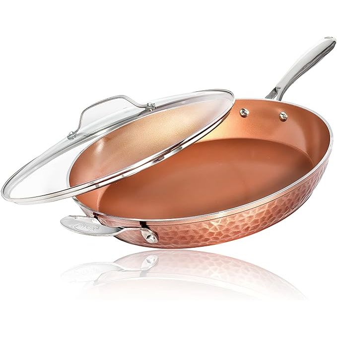 Upgrade your cooking experience with the Gotham Steel Hammered Copper 14 Inch Non Stick Frying Pan. With a ceramic coating for a non-stick surface and an induction plate for even heating, this pan ensures your meals are cooked to perfection every time.