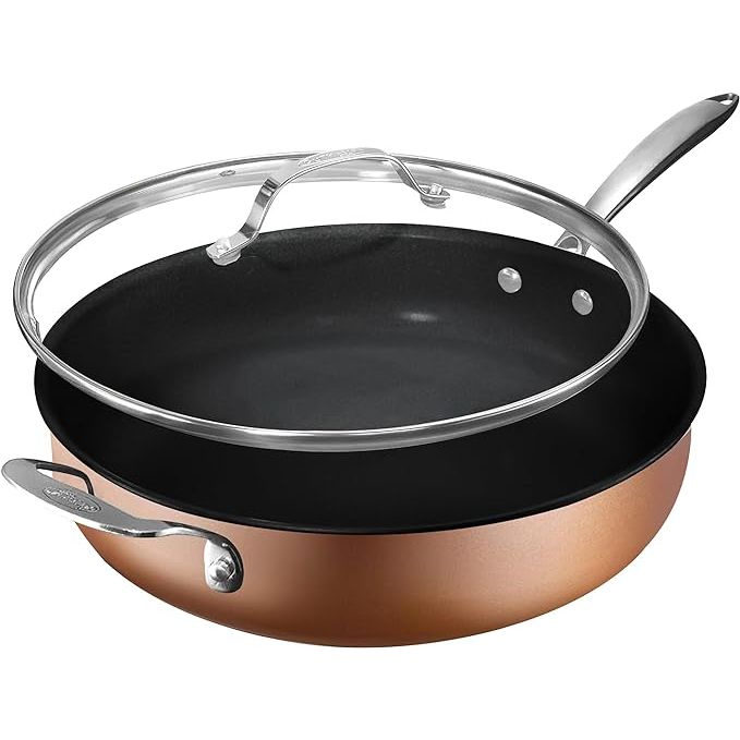 Upgrade your cooking experience with the Gotham Steel 5.5 Qt Saute Pan with Lid. This versatile and durable pan is perfect for everyday cooking tasks, with its deep design ideal for sautéing, searing, and frying a variety of ingredients. Made of 100% PFOA-free ceramic material, you can cook worry-free knowing no harmful chemicals are released.