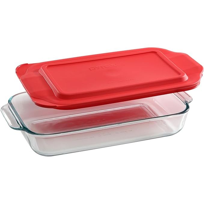 The Pyrex Basics 2-Qt Glass Baking Dish with Lid is a must-have kitchen staple crafted from durable tempered glass. Whether you're whipping up a savory casserole or a sweet dessert, this versatile dish is up to the task. With convenient large handles, you can easily transfer your creations from oven to table with ease.