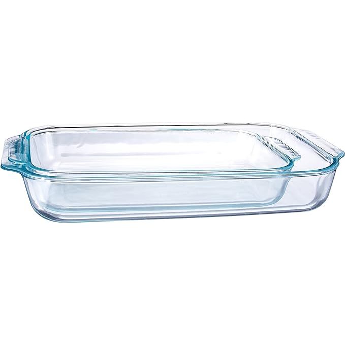 Enhance your baking experience with the versatile and durable Pyrex Basics Clear Oblong Glass Baking Dishes. This convenient 2-piece set includes a 2-quart and a 3-quart dish, both crafted from high-quality, non-porous glass that maintains food integrity without absorbing odors, flavors, or stains.