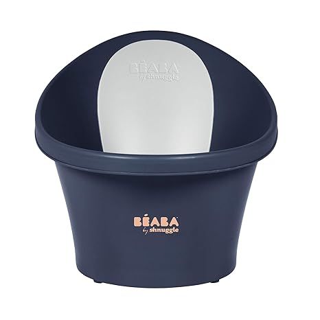 The BEABA by Shnuggle Baby Bath Tub is a versatile baby bath tub designed to make bath time easier and more comfortable for both parents and babies. It features a unique Little Baby Bum bump support to help keep your little one secure and in the optimal bathing position.