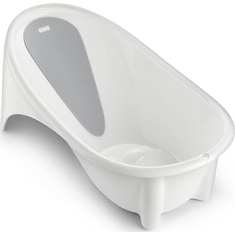 The Fisher-Price Baby To Toddler Bath Simple Support Tub is a versatile baby bath tub designed to grow with your child from infancy to toddlerhood. It features a built-in foam head and backrest to provide support and comfort for newborns during bathtime.