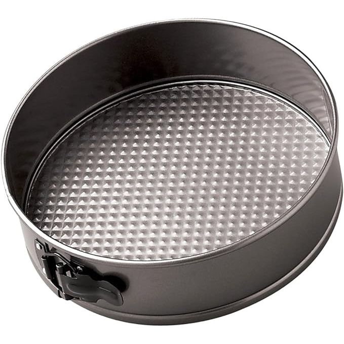 The Wilton Excelle Elite Non-Stick Springform Pan is a versatile and high-quality baking tool perfect for creating a variety of delicious dishes, from cheesecakes to deep dish pizzas. Made of durable steel with a non-stick coating, this 10-inch pan allows for easy release of baked goods and effortless cleanup.