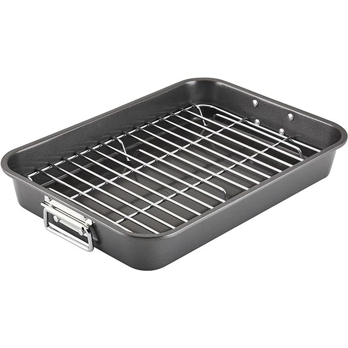 Enhance your cooking experience with the Farberware Bakeware Nonstick Steel Roaster with Flat Rack. This 11x15 inch roaster is perfect for preparing a wide range of dishes, from savory roasts to delicious lasagnas. The included flat rack ensures even cooking and improved air circulation for perfect results every time.