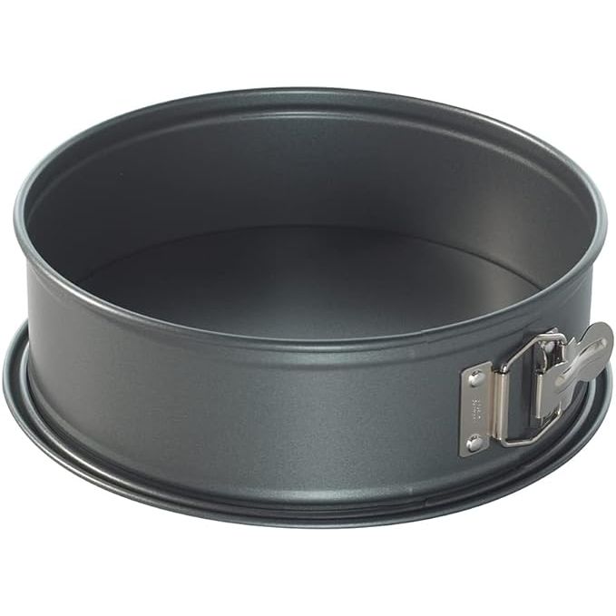 The Nordic Ware Pan Springform is a sleek and modern 9-inch round baking pan designed for easy release of delicate cakes and desserts. Crafted from durable carbon steel with a non-stick coating, this pan ensures even baking and effortless cleanup. Its charcoal color adds a touch of sophistication to any kitchen decor.