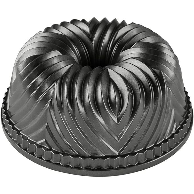 Experience the traditional designs of the Bavarian region of Germany with the Nordic Ware Bavaria Bundt Pan. This 10-cup capacity baking pan is crafted from sturdy cast aluminum with a nonstick coating for easy release and cleanup. The intricate details on the pan add a unique and elegant touch to your baked goods, making them stand out.