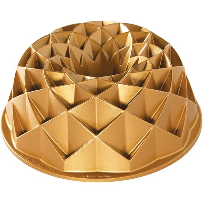 The Nordic Ware Jubilee Bundt pan is a sophisticated 10-cup capacity baking pan featuring an intricate design that adds an elegant touch to your baked goods. Crafted from heavy cast aluminum, this durable pan ensures even baking and superior heat conduction for consistently delicious results.