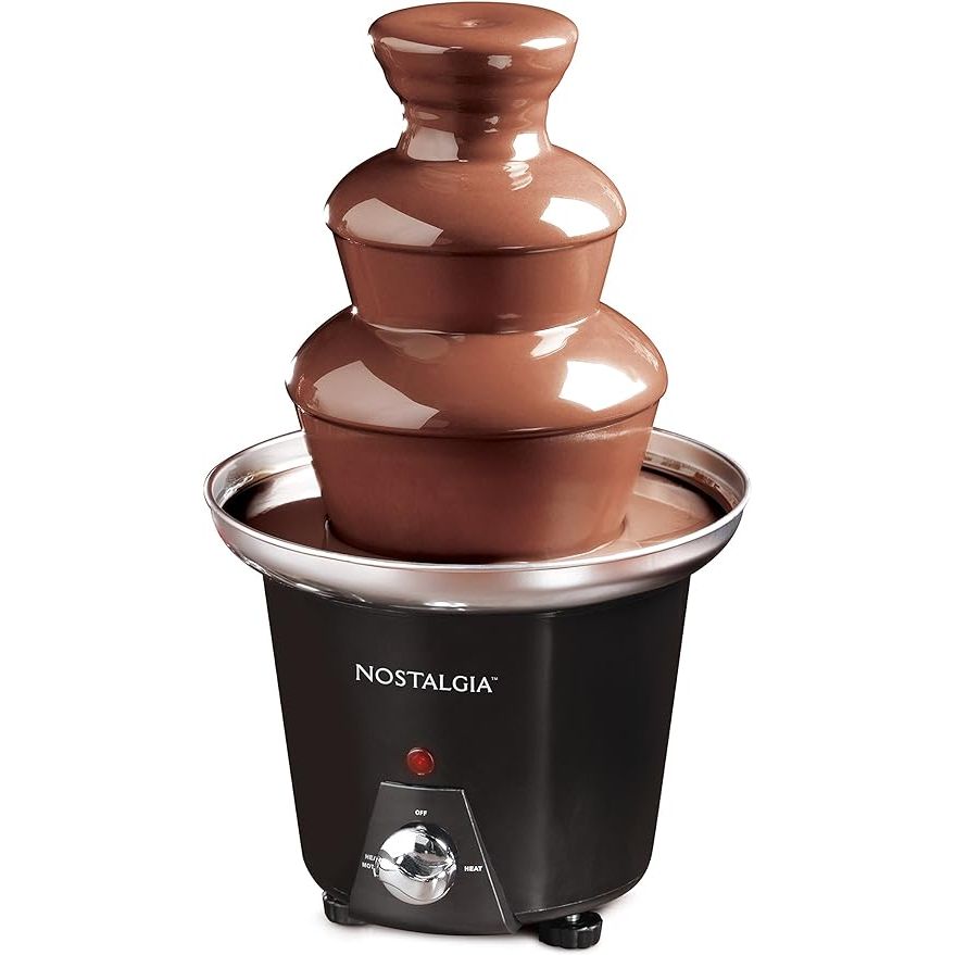 Elevate your party experience with the Nostalgia 3 Tier Electric Chocolate Fondue Fountain Machine. This compact and versatile fountain machine is perfect for melting chocolate, cheese, candy, and more, allowing you to create a variety of delicious treats for your guests to dip.