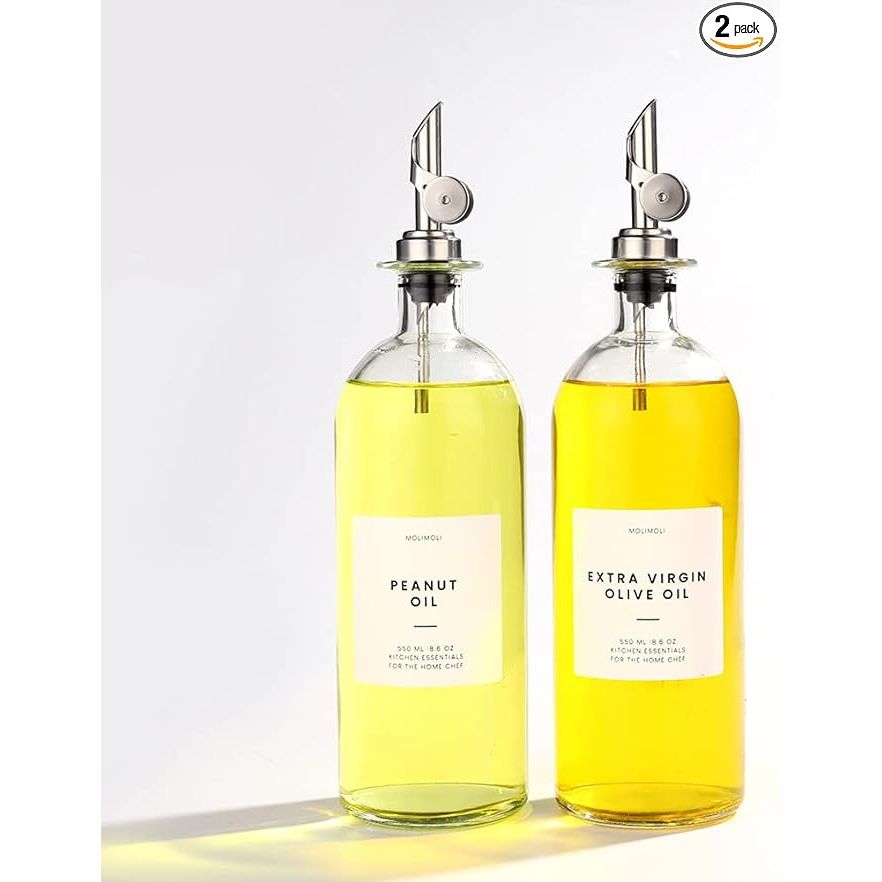 Elevate your kitchen with the Minimalism Inspired Cooking Oil Dispenser Bottle set. This set includes two high-quality 16.9oz glass bottles, two silver pourers, a funnel, and a 36 label set. The pourers feature a weighted spout and tight metal cap to prevent dust, offering both style and functionality.