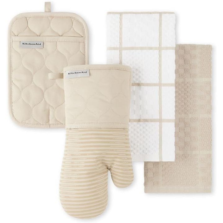 Explore our chic and practical kitchen set, the perfect addition to elevate the style of your cooking space. Crafted from 100% durable, heat-resistant cotton, this set includes two soft kitchen towels, one pot holder, and one oven mitt, all adorned with a charming solid and trellis design.