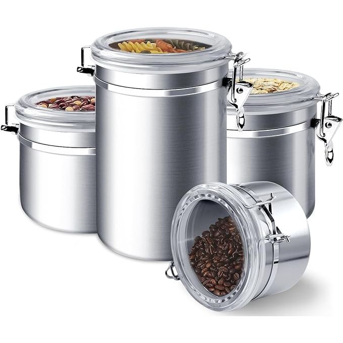 The ENLOY 4-Piece Stainless Steel Airtight Food Storage Canister Set is a stylish and practical solution for storing a variety of food items in your kitchen. This set includes four different sizes of canisters, 28 oz, 32 oz, 38 oz, and 65 oz, allowing you to conveniently store sugar, flour, tea, candy, cookies, spices, and more.