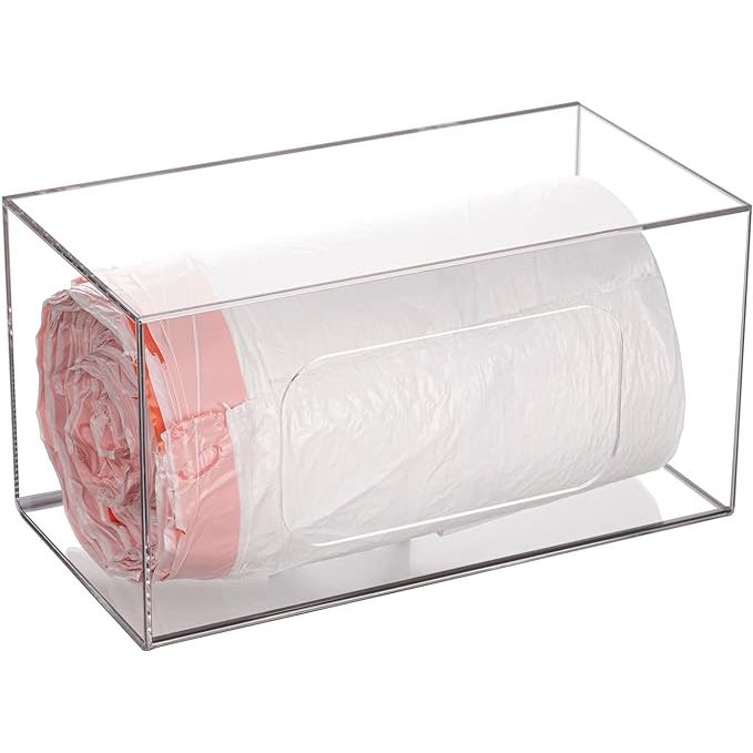 Experience the ultimate solution in decluttering your kitchen space with our sleek and innovative Trash Bag Dispenser Roll Holder. Tailor-made for the eco-conscious and organization aficionados, this chic wall-mounted acrylic storage unit effortlessly streamlines your collection of plastic shopping bags, garbage bags, and grocery bags.