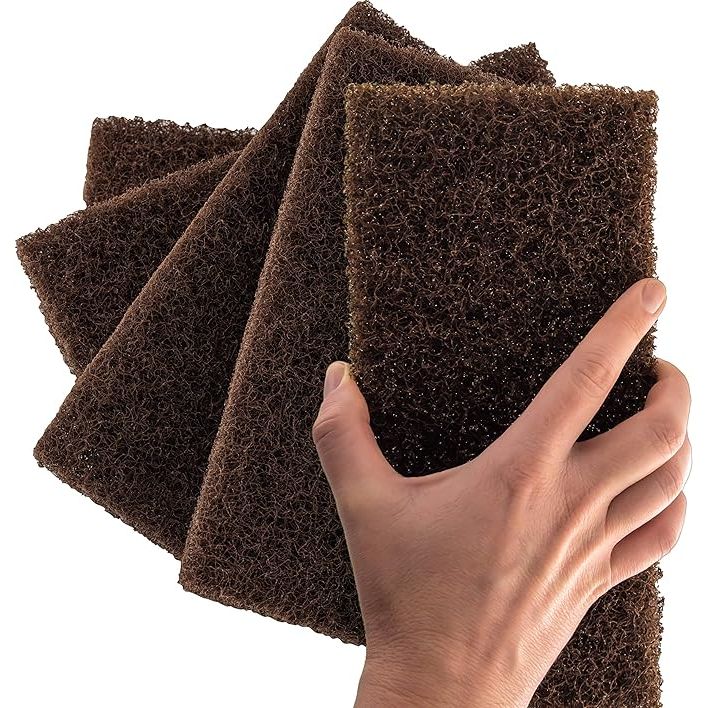 Maximize your cleaning efficiency with the Professional Grade XL Brown Scouring Pad 5-Pack – your go-to solution for relentless dirt and the most challenging grime. Expertly crafted to a generous 10 x 4.5 inches, these industrial-strength nylon scrubbing pads are specifically designed to cover more area in less time.