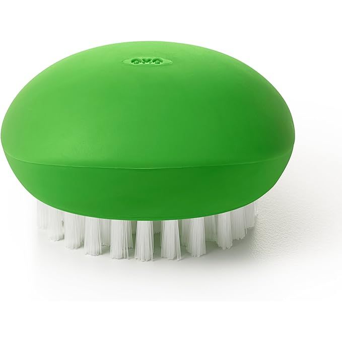 Elevate your kitchen essentials with the OXO Good Grips Vegetable Brush—a must-have for health-conscious cooks. Boasting a contemporary black and green design, this kitchen accessory not only accents your space with a modern flair but also promises a pristine clean for your produce.