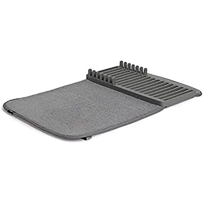 Maximize your kitchen space while incorporating sleek design with the Umbra UDRY Rack and Microfiber Dish Drying Mat. This innovative kitchen accessory ingeniously merges the functionality of a dish rack with the absorbency of a microfiber mat, streamlining your dish-drying process with style and efficiency.