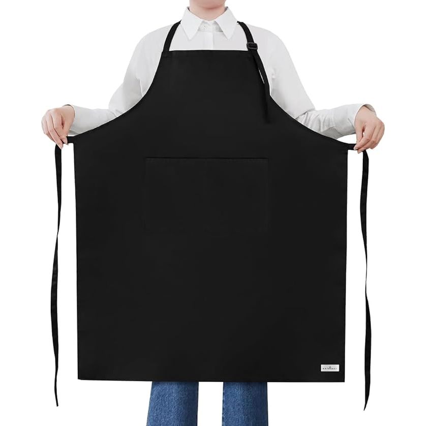 Step into your kitchen with confidence and style with our Extra Large Apron for Men—your ultimate companion for any culinary adventure. Crafted with high-quality materials, this apron boasts a blend of functionality and durability, featuring a water and oil-resistant fabric that ensures hassle-free upkeep.