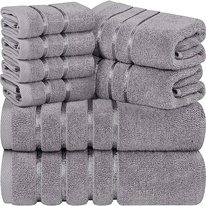 The Utopia Towels 8-Piece Luxury Towel Set includes 2 bath towels, 2 hand towels, and 4 wash cloths, all made from 100% ring spun cotton. These towels are highly absorbent and feature a viscose stripe design for added style. The set has a 600 GSM (grams per square meter) rating, making them plush and soft to the touch.