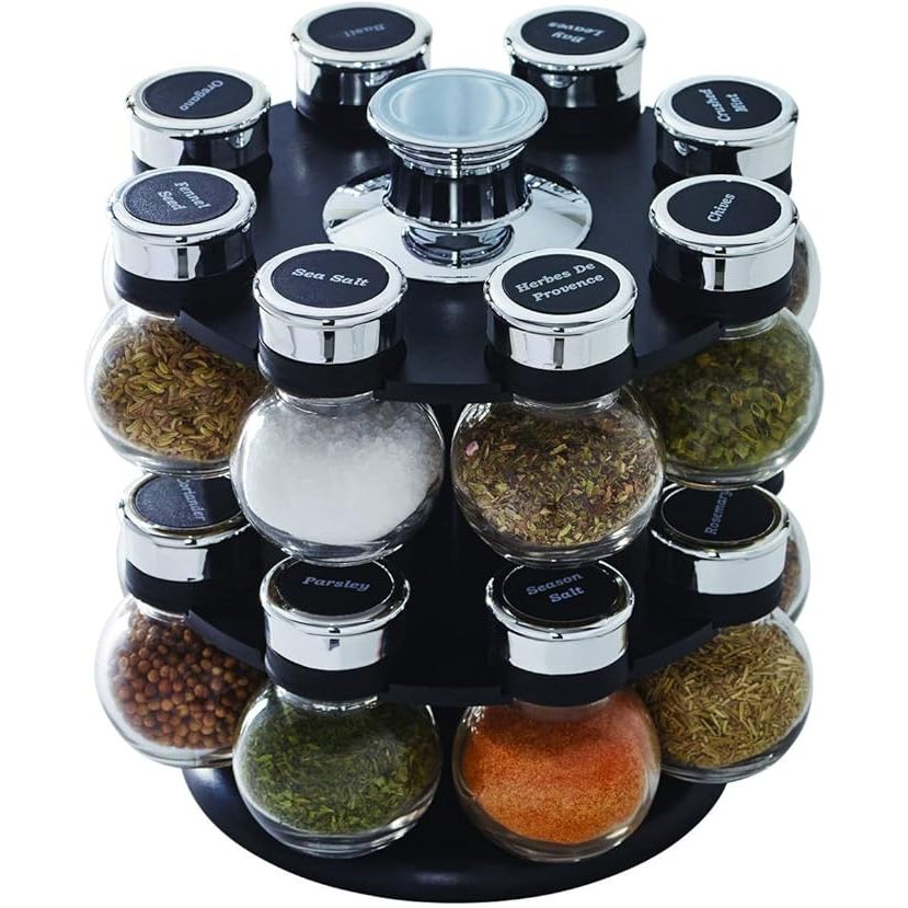 Elevate your culinary creations and infuse your kitchen with elegance with the Kamenitian 16-Jar Ellington Revolving Spice Rack. This essential countertop masterpiece not only offers ease with its 16 pre-filled premium spices—including staples like basil, thyme, and aromatic cinnamon—but ensures your seasoning arsenal is always within reach.