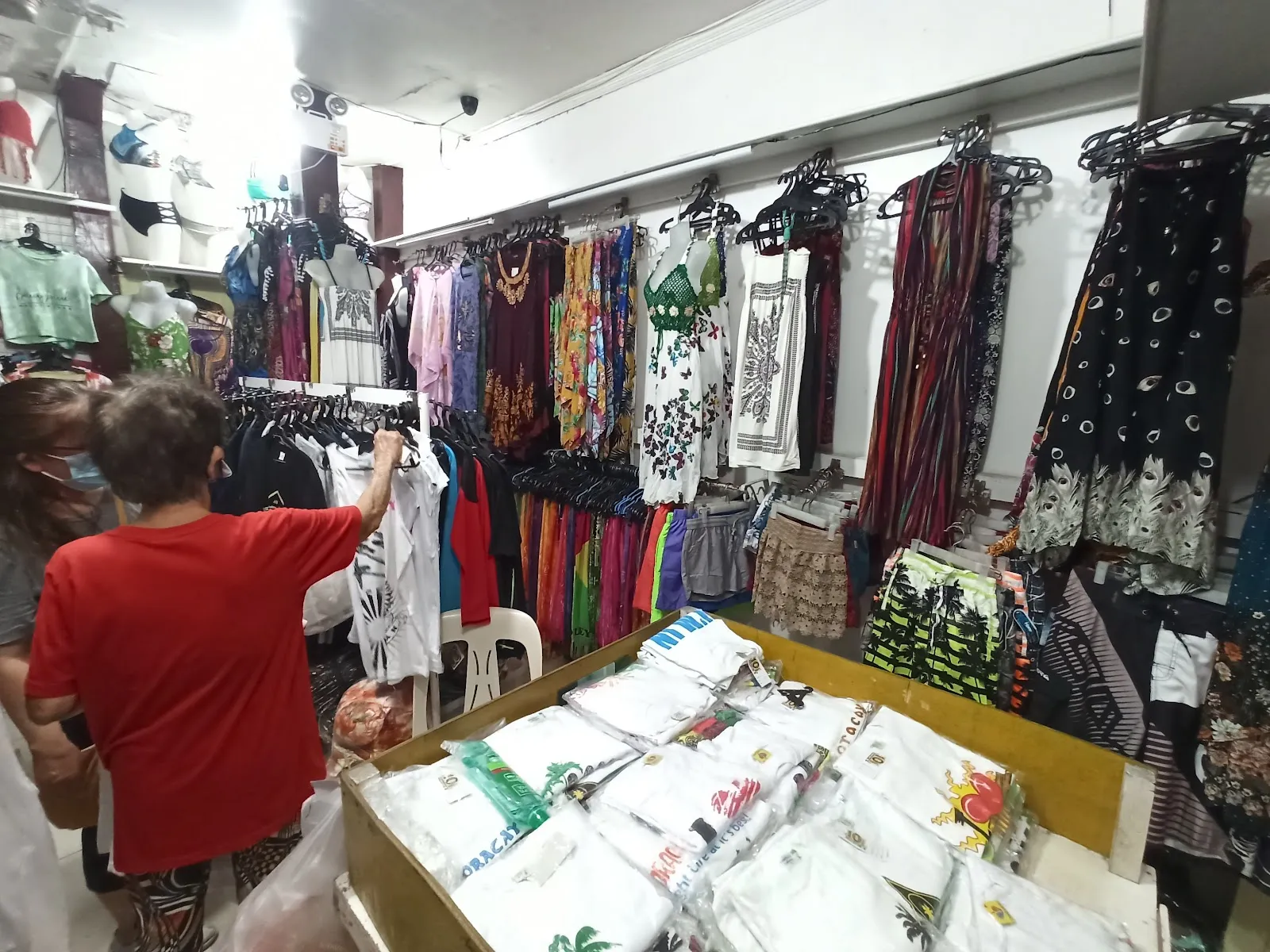 Patrons are bound to find something that piques their interest within the extensive selection that spans swimwear, casual wear, and a variety of souvenir items. Whether you're in pursuit of a stylish bikini or a casual t-shirt dress, the store boasts an impressive inventory catering to different tastes and sizes, ensuring there's something for everyone. The extensive range of "Boracay" branded t-shirts is particularly popular amongst those wanting to take a piece of the island home with them.